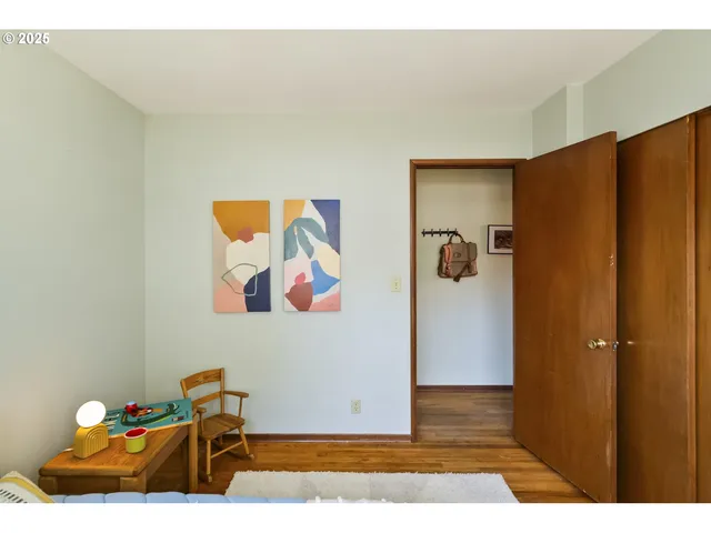 a view of room with furniture and wooden floor