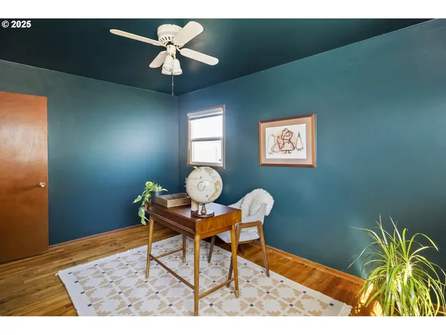 a workspace with furniture and chandelier