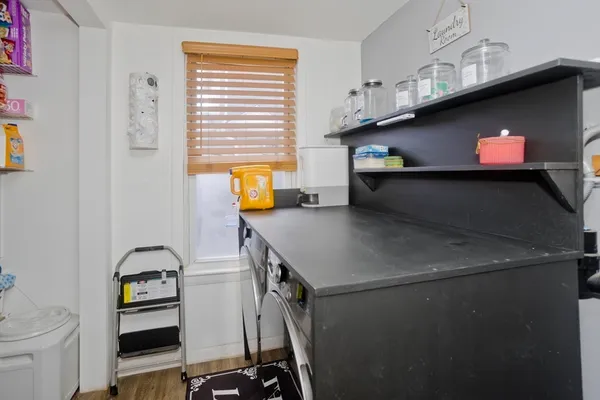 a kitchen with stainless steel appliances a stove microwave and cabinets
