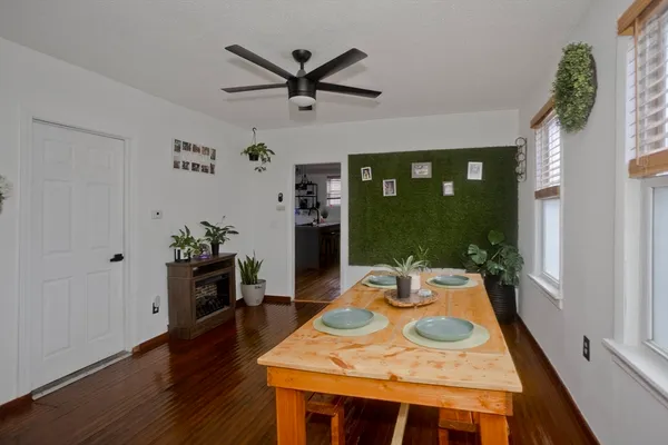 a view of a dining room with furniture window and wooden floor