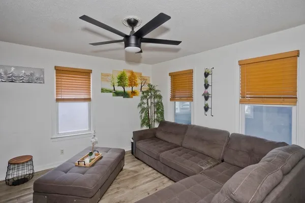 a living room with furniture and a window