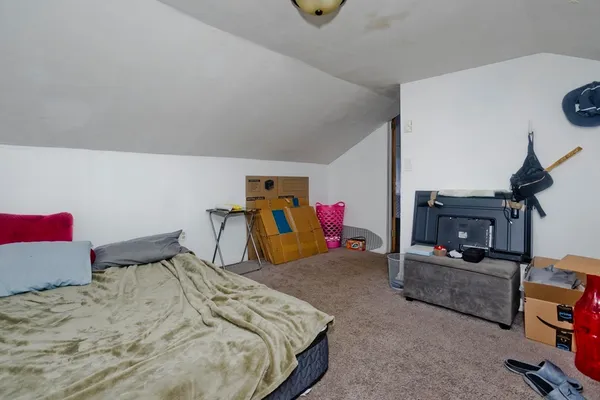 a bedroom with a bed and cabinets