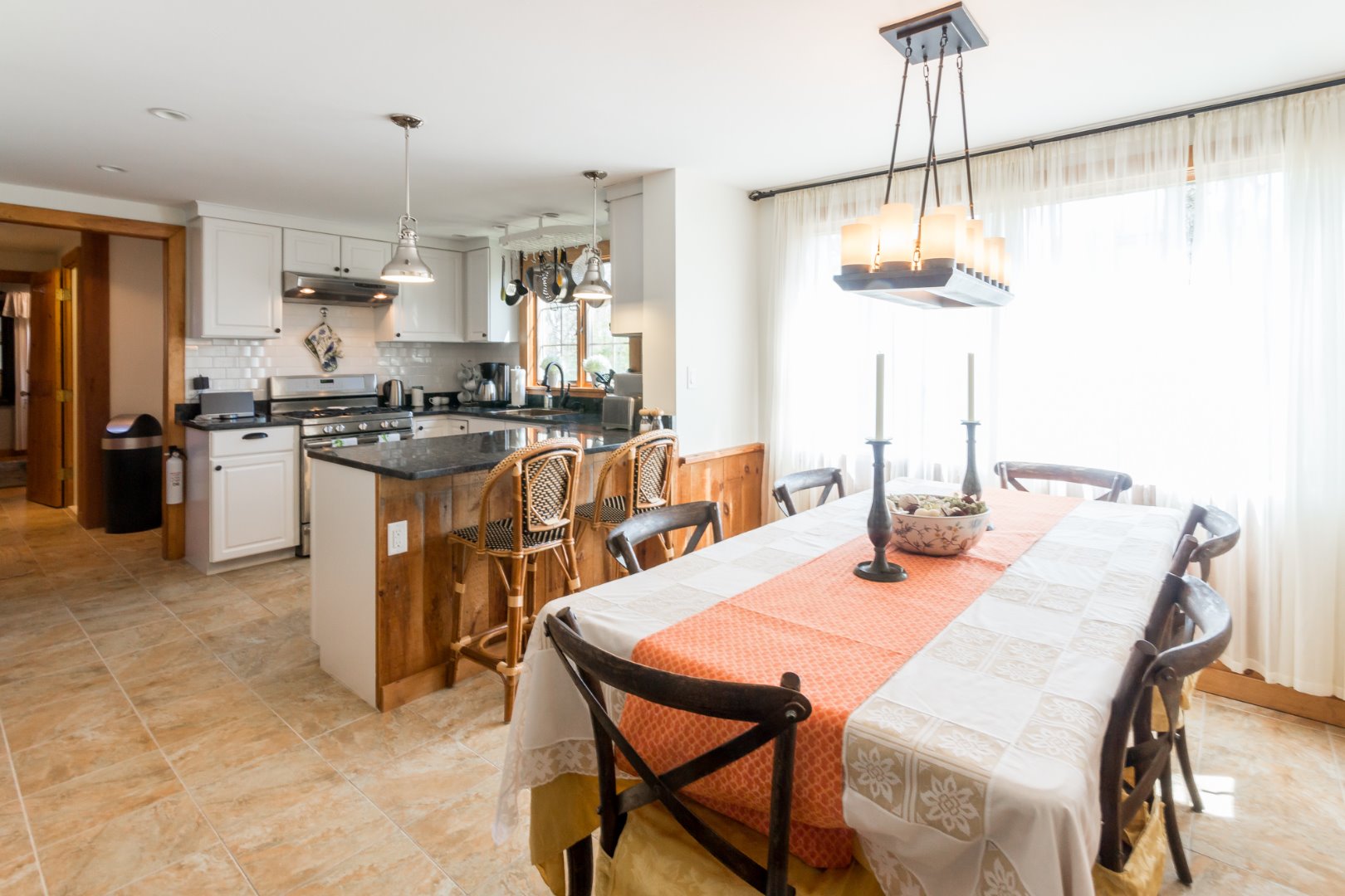 37 Edgartown Meadows Road Edgartown, MA 02539 - Photo 15 of 38 a kitchen with a table and chairs in it