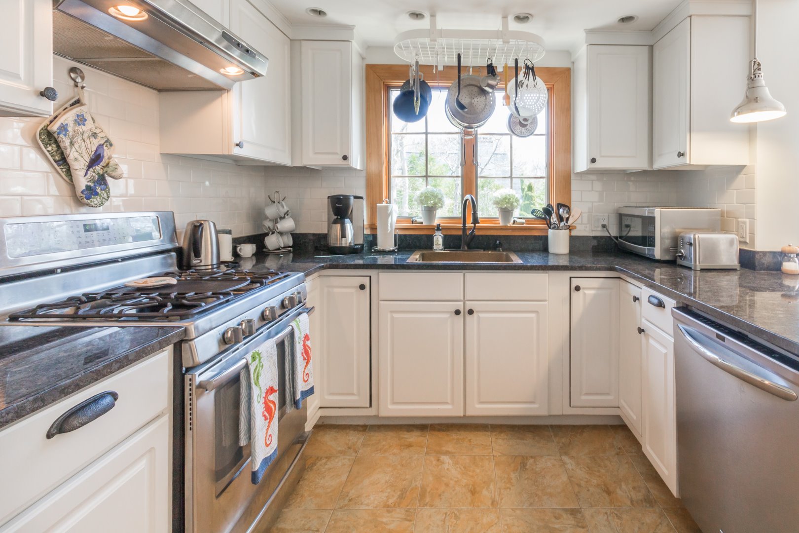 37 Edgartown Meadows Road Edgartown, MA 02539 - Photo 17 of 38 a kitchen with stainless steel appliances granite countertop a stove a sink and a white cabinets
