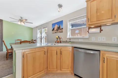 a view of living room with granite countertop furniture and flat screen tv