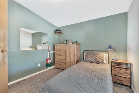 a bedroom with a bed and a closet