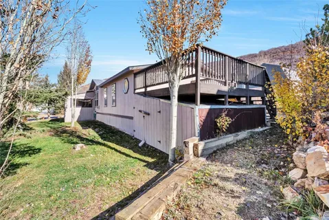 a view of a house with a small deck