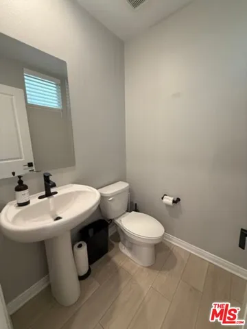 a large room with lots of counter space and windows