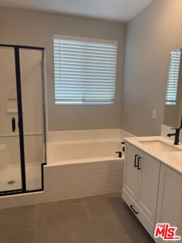 an empty room with closet and a hallway