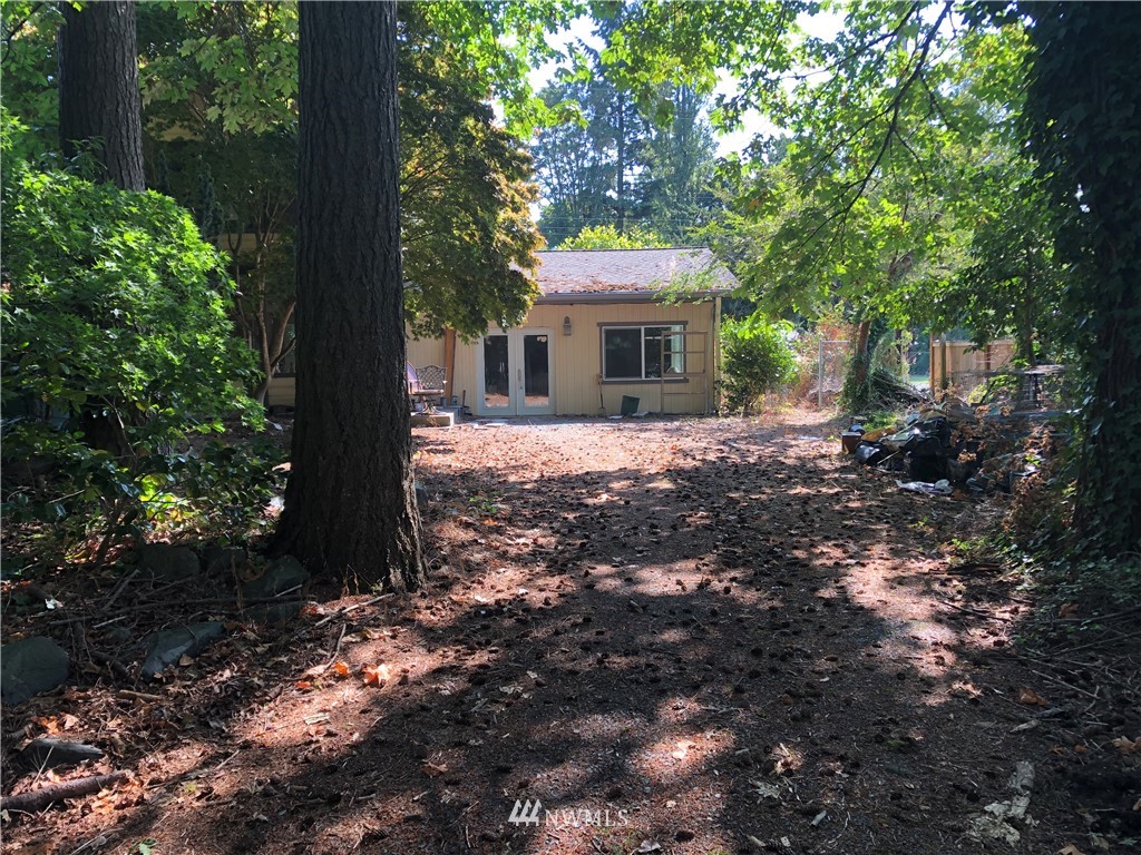 23815 45th Avenue Southeast Bothell, WA 98021 - Photo 1 of 1 a front view of a house with a garden