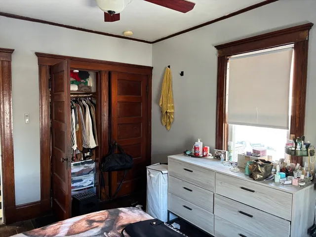 a bedroom with a bed and a closet