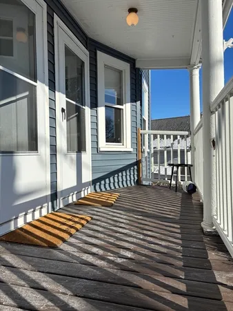 a backyard of a house with wooden floor