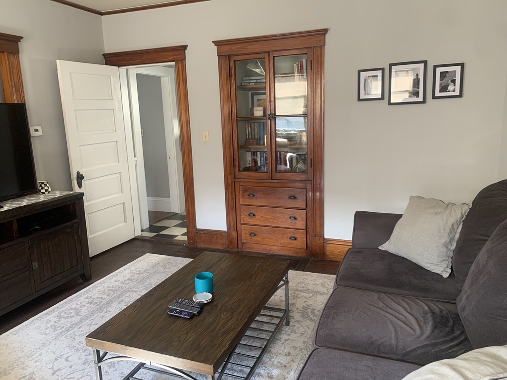 97 Nightingale Avenue, Unit 2 Quincy, MA 02169 - Photo 3 of 17 a living room with furniture and wooden floor