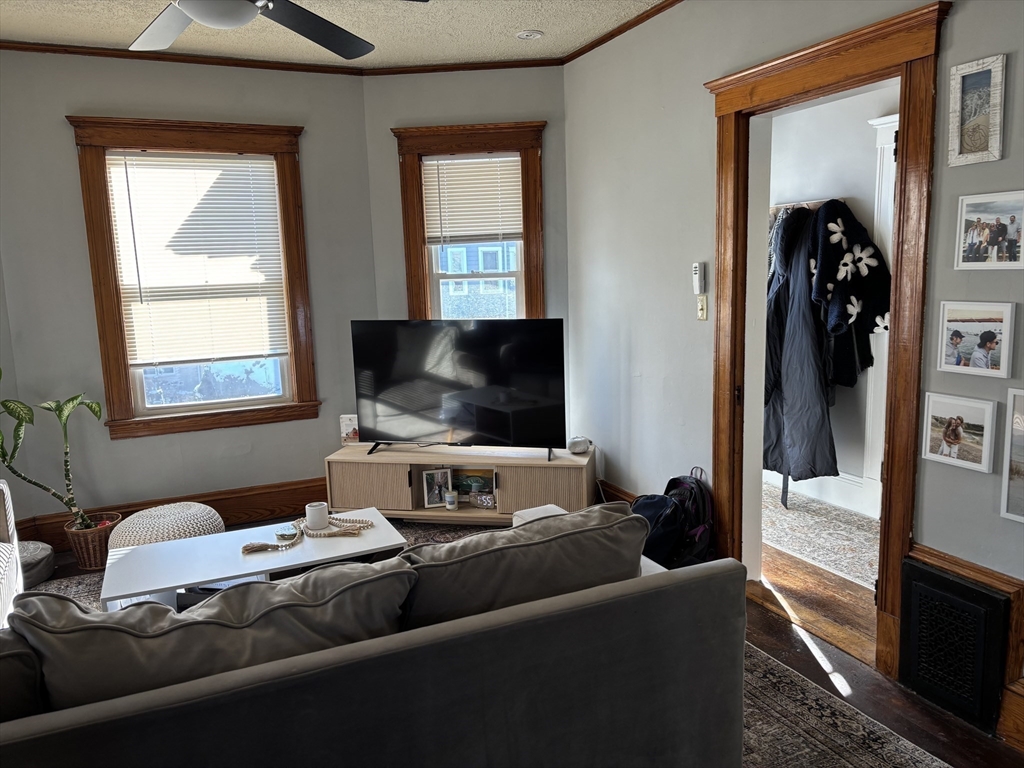 97 Nightingale Avenue, Unit 2 Quincy, MA 02169 - Photo 4 of 17 a living room with furniture and a flat screen tv