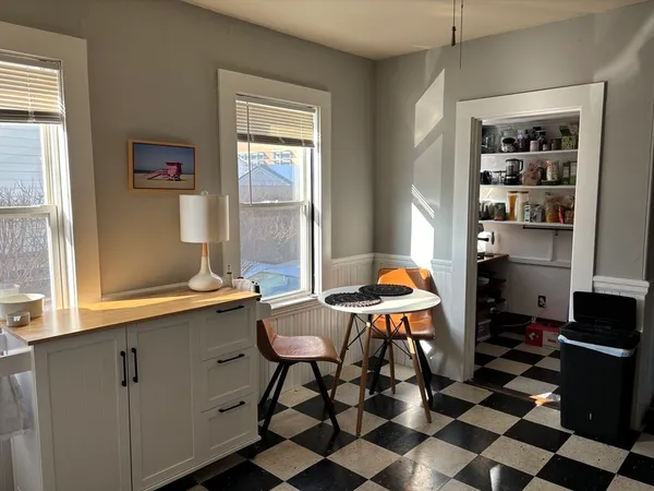 a room with furniture a rug and a window