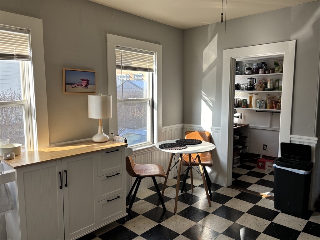 97 Nightingale Avenue, Unit 2 Quincy, MA 02169 - Photo 9 of 17 a room with furniture a rug and a window