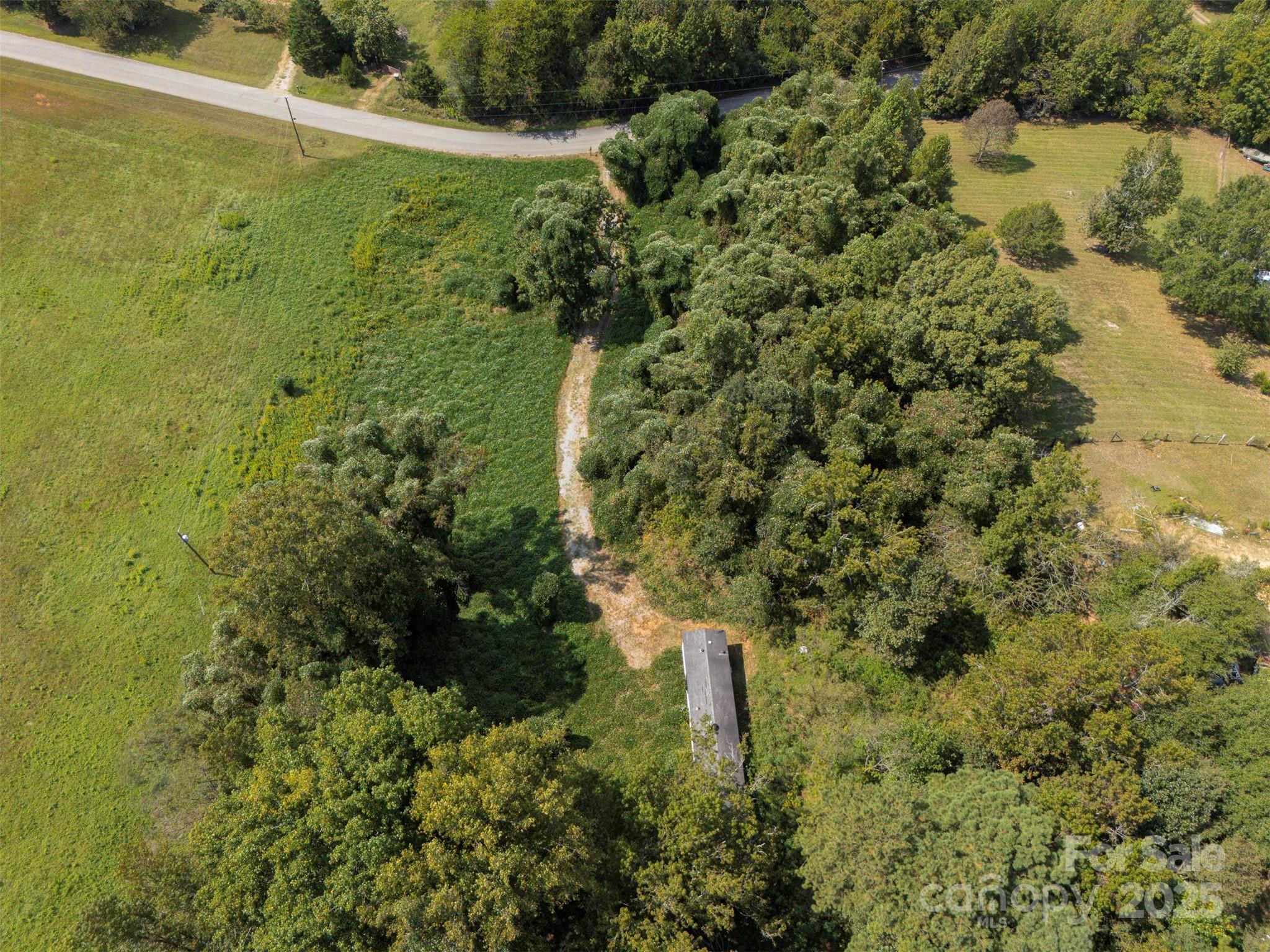 259 Roberts Road Blacksburg, SC 29702 - Photo 6 of 8 a view of a lake with a house