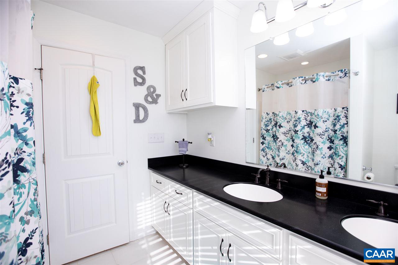 962 School Road Farmville, VA 23901 - Photo 12 of 41 a bathroom with a granite countertop sink a toilet and shower