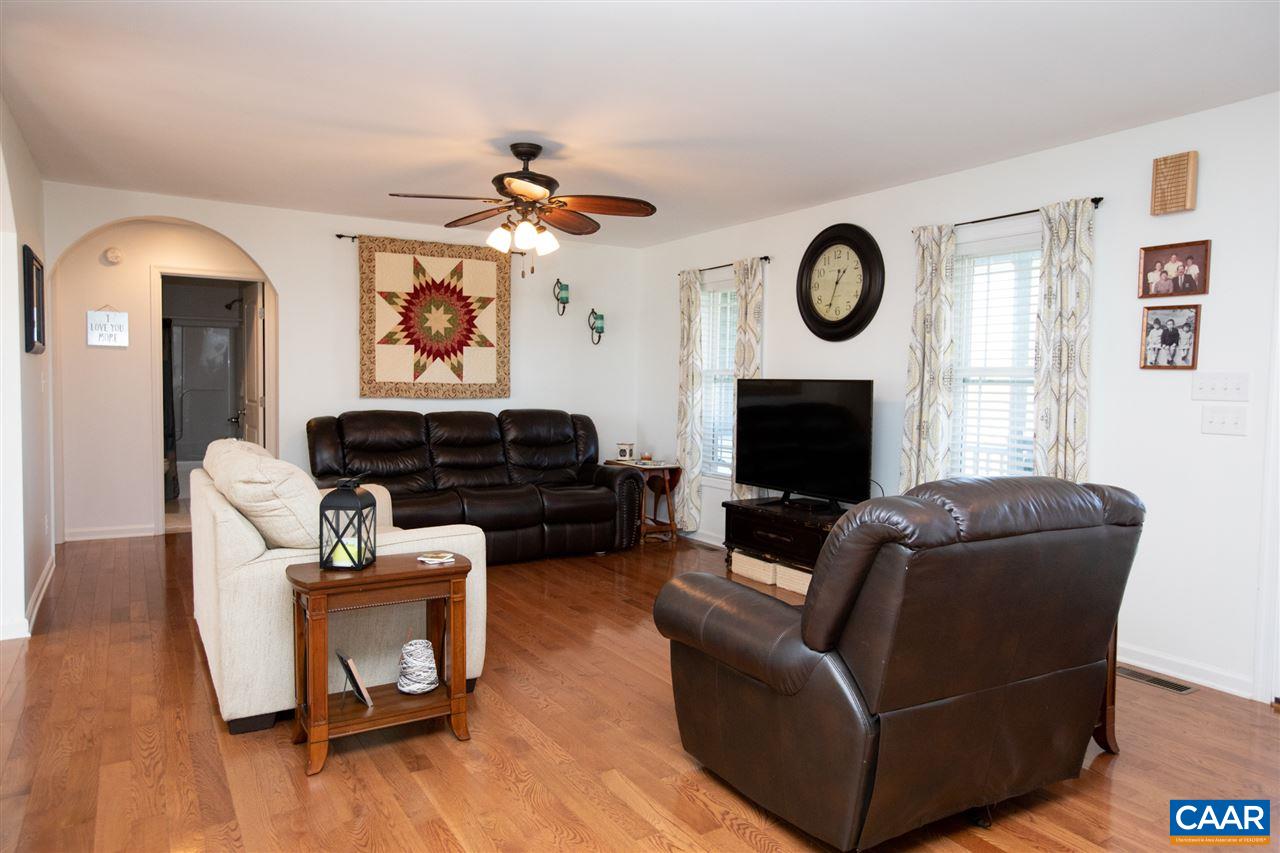 962 School Road Farmville, VA 23901 - Photo 8 of 41 a living room with furniture a wooden floor and a fireplace