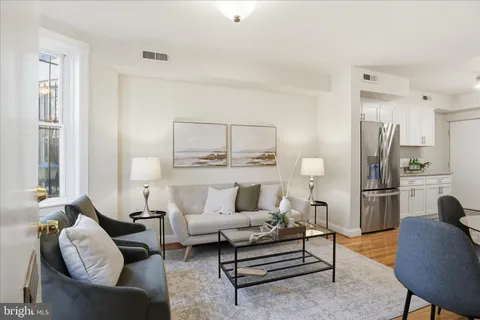a living room with furniture and a table
