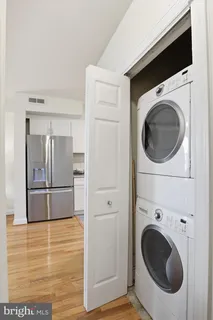 a view of a kitchen with a washer and dryer
