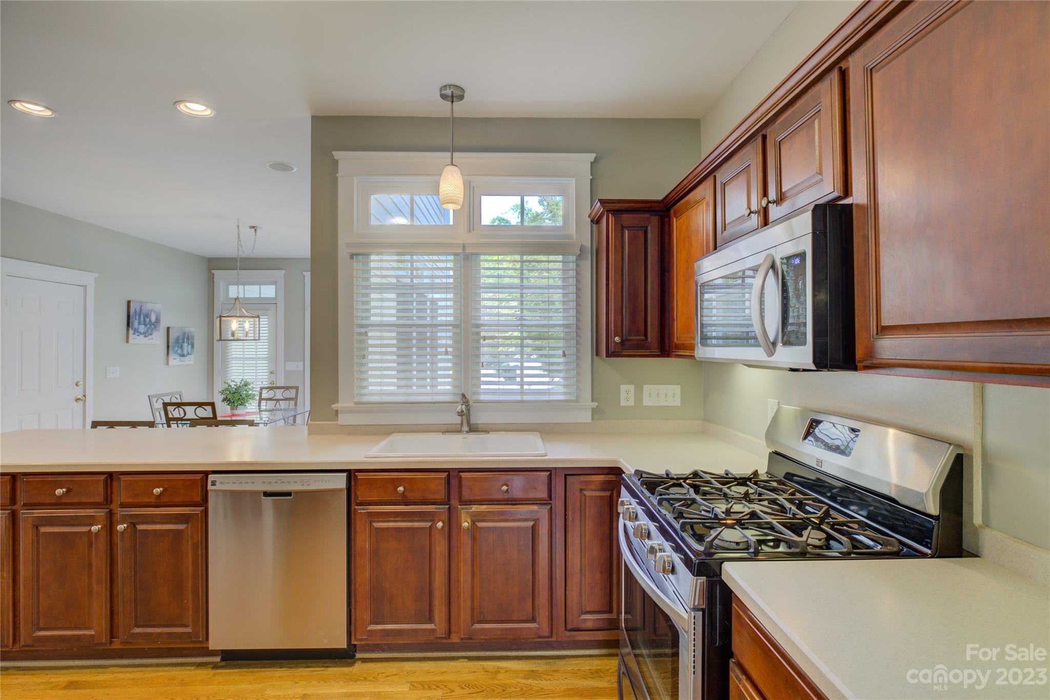 357 Elis Way Fort Mill, SC 29708 - Photo 15 of 48 a kitchen with granite countertop a stove and a sink