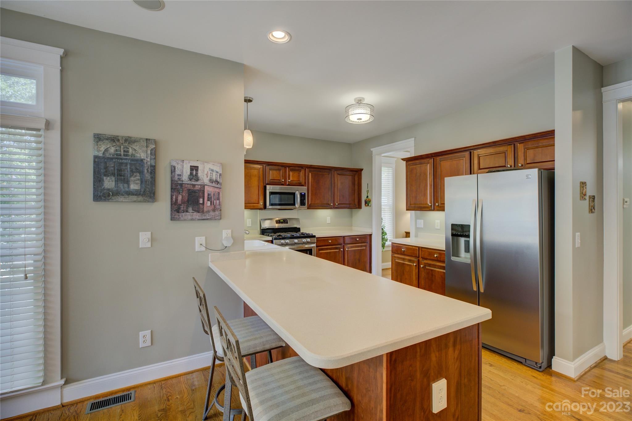 357 Elis Way Fort Mill, SC 29708 - Photo 16 of 48 a kitchen with cabinets and stainless steel appliances