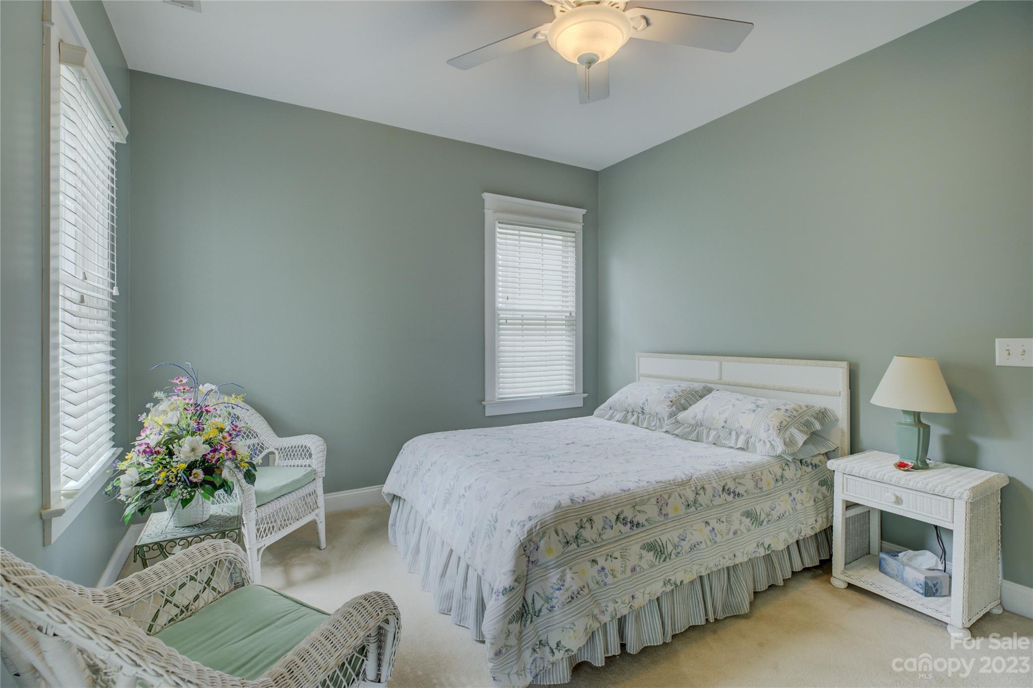 357 Elis Way Fort Mill, SC 29708 - Photo 37 of 48 a bedroom with a bed and a chandelier