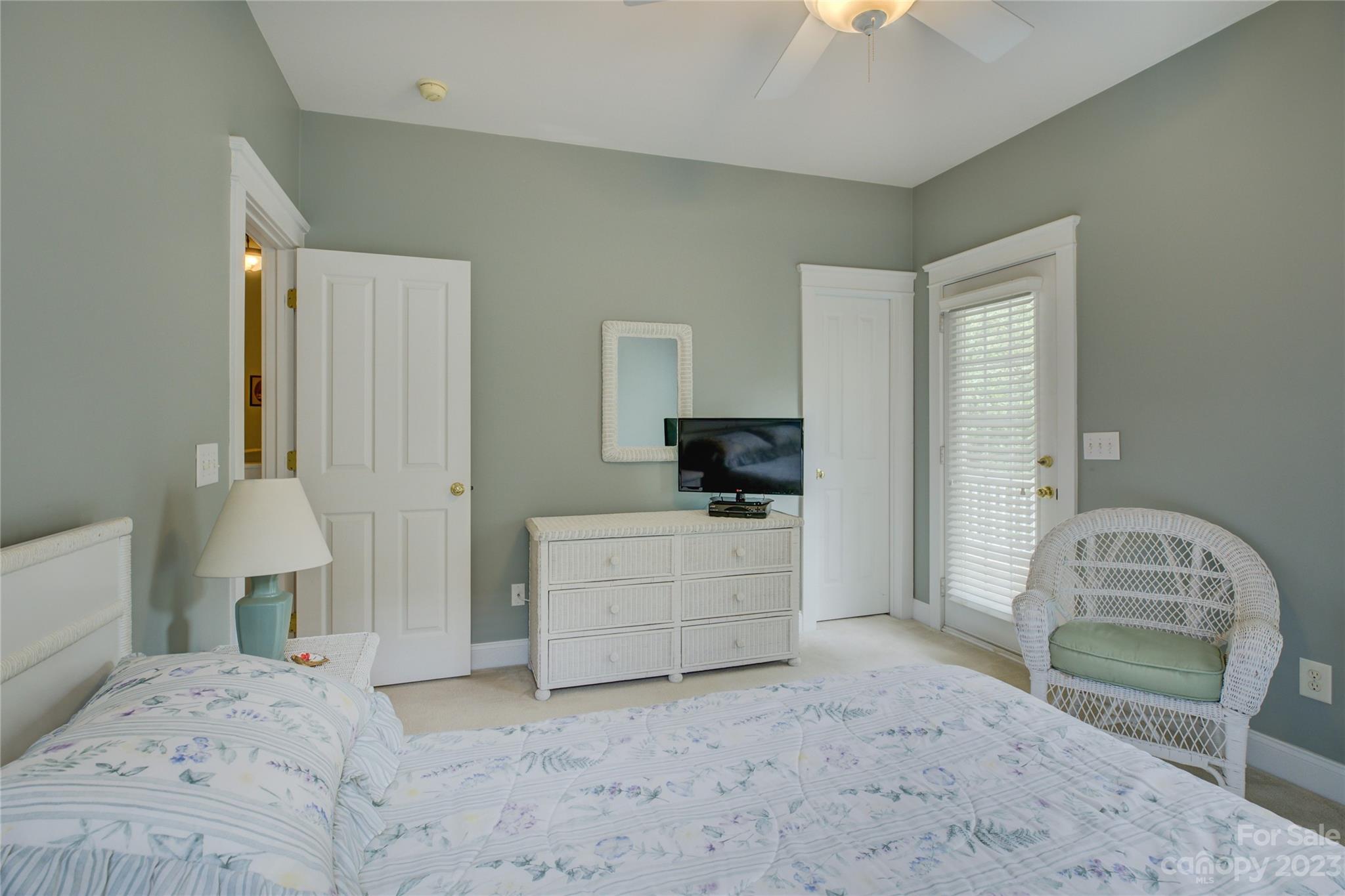 357 Elis Way Fort Mill, SC 29708 - Photo 38 of 48 a bedroom with a bed and a chandelier