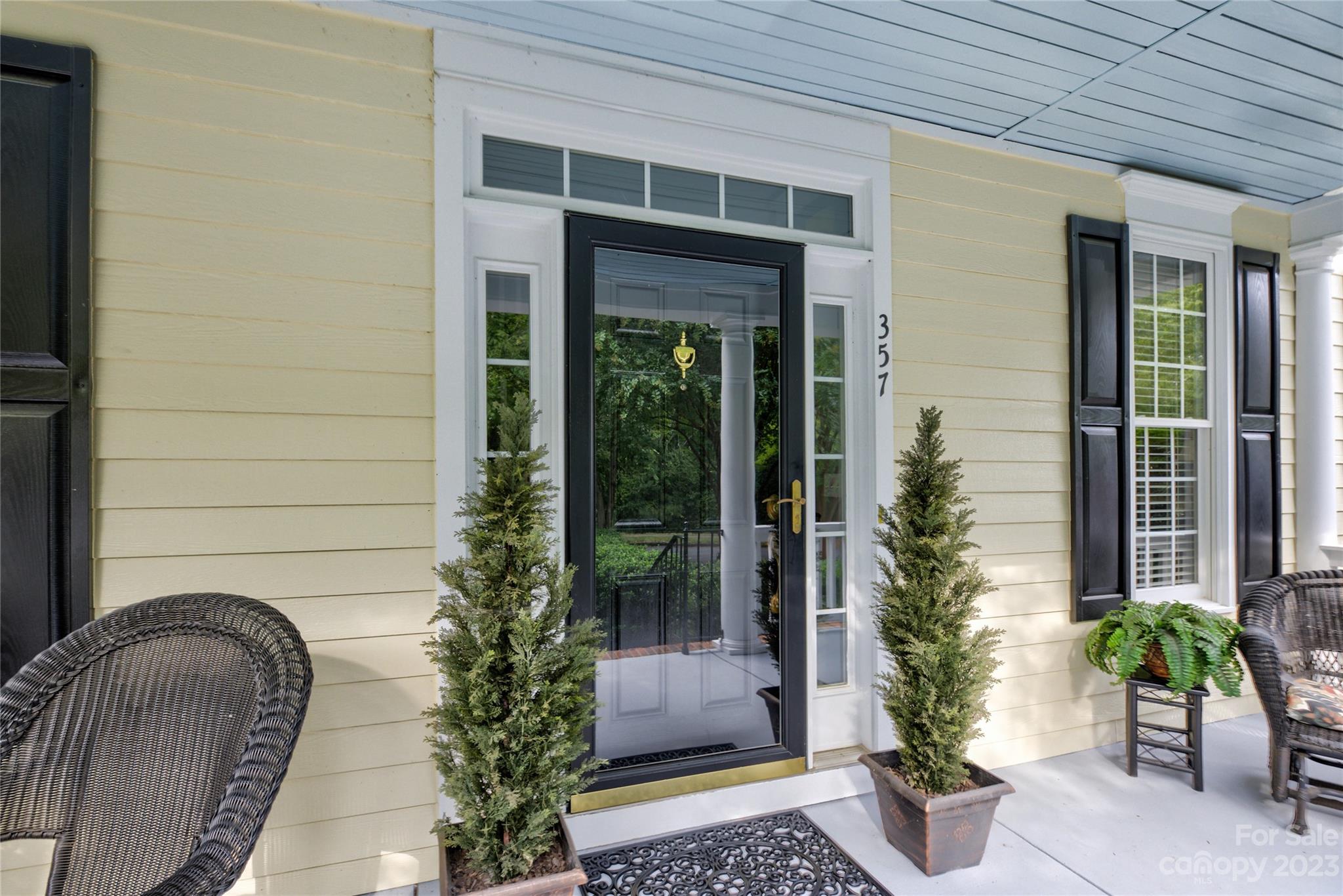 357 Elis Way Fort Mill, SC 29708 - Photo 4 of 48 a potted plant sitting in front of a house