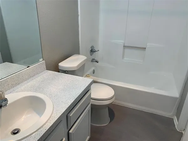 a bathroom with a sink and toilet