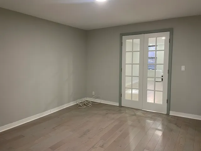 wooden floor and window in an empty room