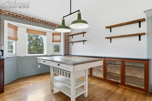 a kitchen with stainless steel appliances granite countertop a stove and a refrigerator