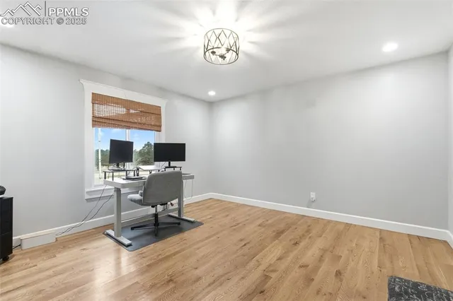 a workspace with furniture hardwood and a window