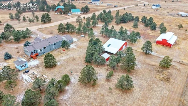 an aerial view of residential houses with outdoor space