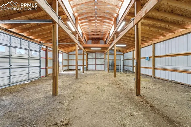 a view of a park with trees and a bench