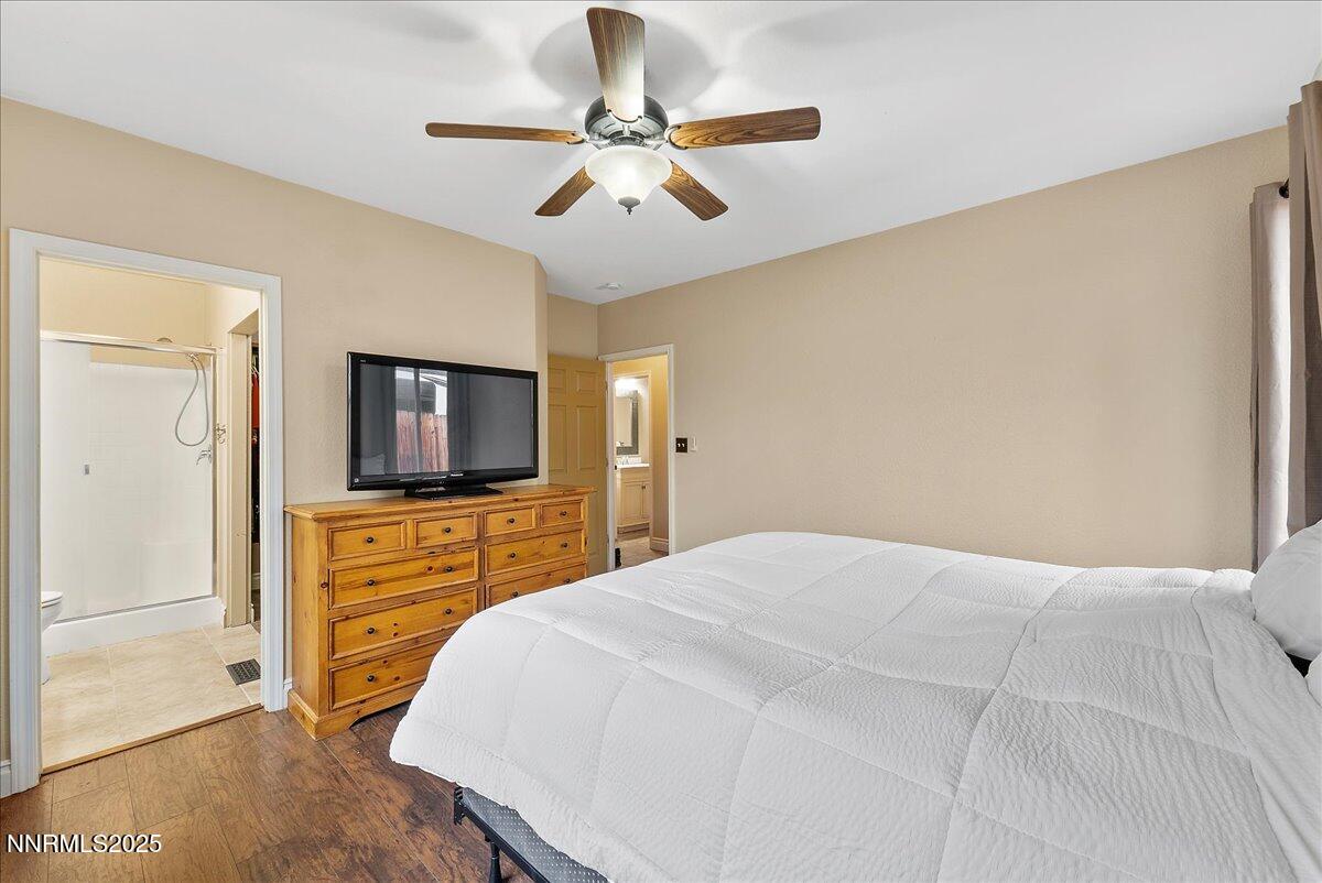 7245 Winterhill Court Reno, NV 89523 - Photo 13 of 25 a bedroom with a bed and a flat screen tv