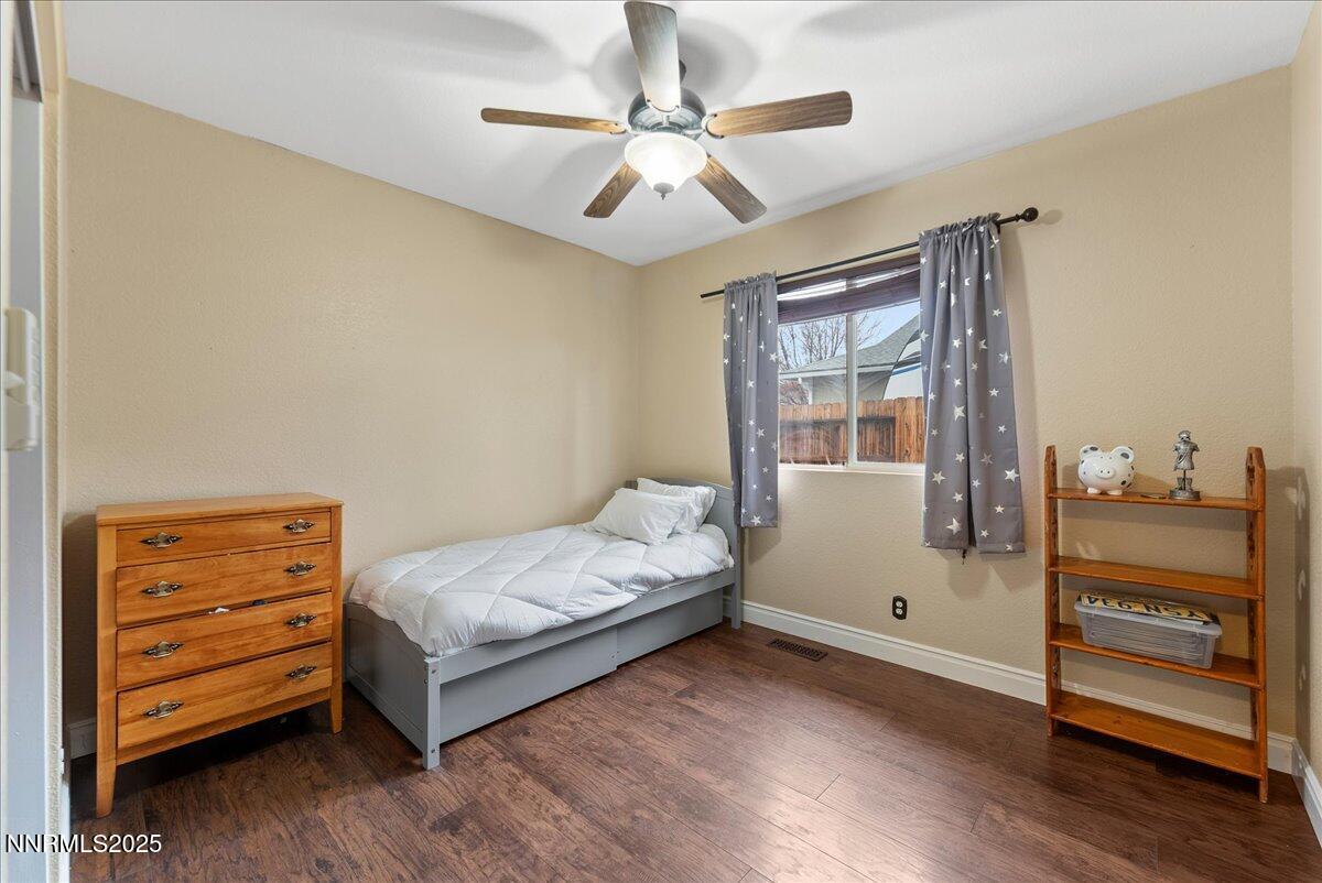 7245 Winterhill Court Reno, NV 89523 - Photo 18 of 25 a bedroom with a bed and a dresser