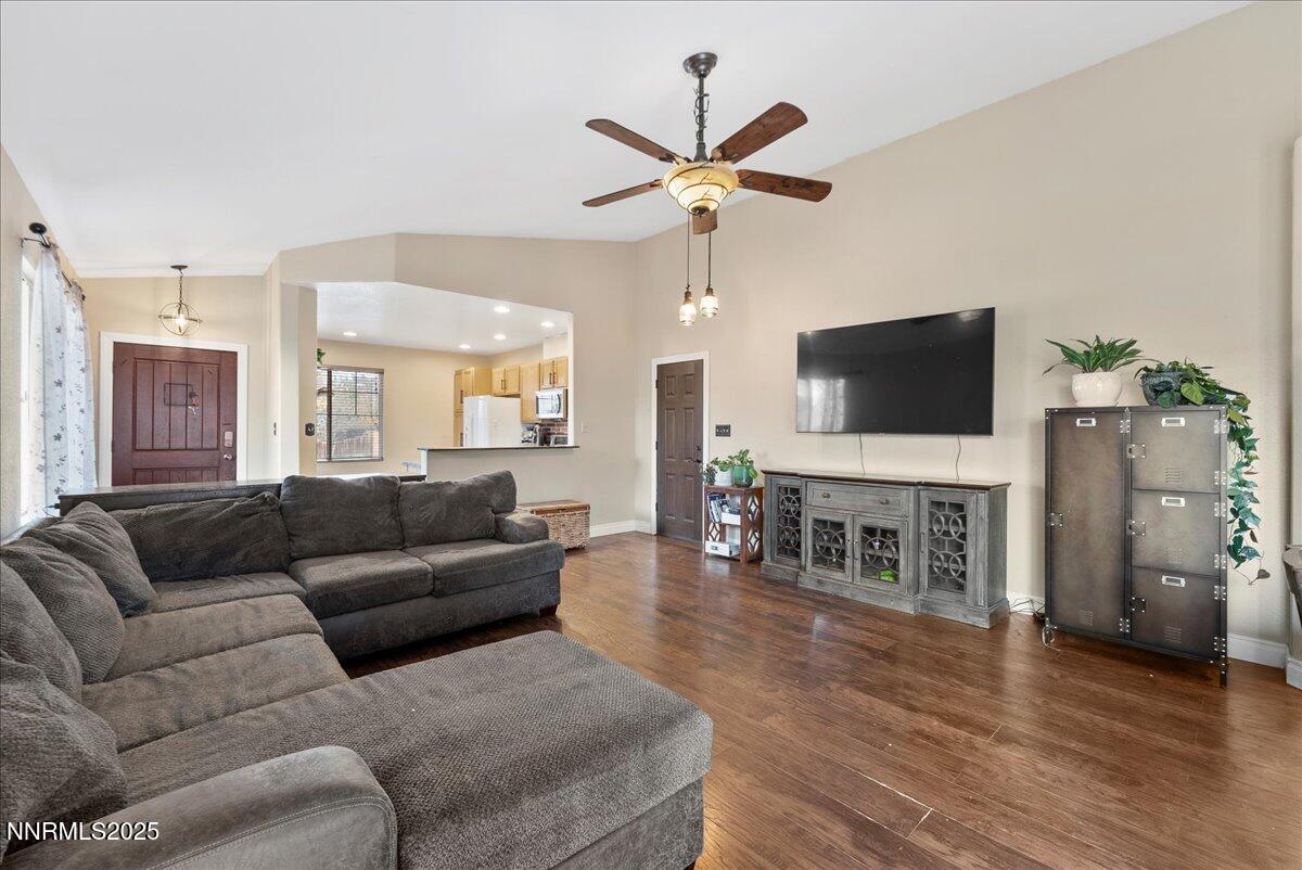 7245 Winterhill Court Reno, NV 89523 - Photo 7 of 25 a living room with furniture and a flat screen tv