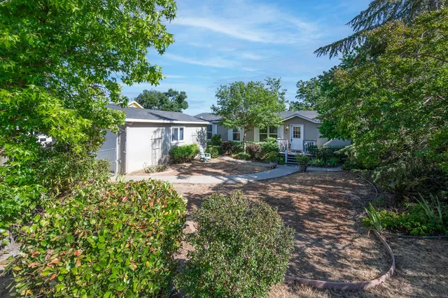 a backyard of a house with lots of green space