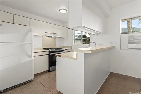 a kitchen with a refrigerator and a sink