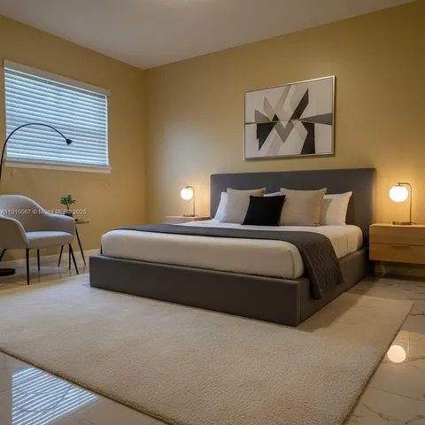 a bedroom with a bed and a painting on the wall