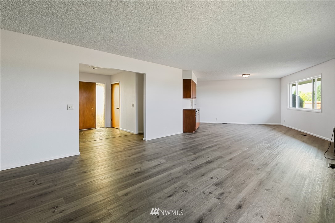 368 West Smith Road Bellingham, WA 98226 - Photo 3 of 24 a view of empty room with wooden floor and fan