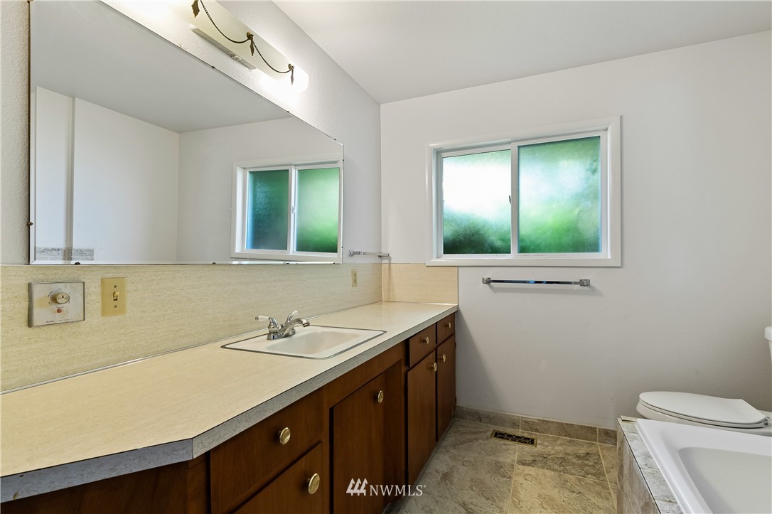 368 West Smith Road Bellingham, WA 98226 - Photo 6 of 24 a bathroom with a sink a toilet and mirror