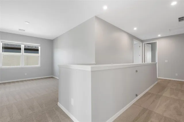 a view of an empty room and window