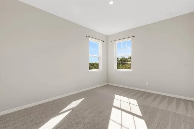 a view of a chairs and table in the patio