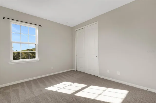 a view of a house with garden and sitting area