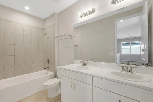 a view of roof deck with a table and chairs under an umbrella