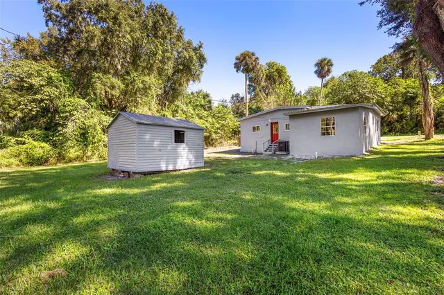 a kitchen with stainless steel appliances a stove sink microwave and refrigerator