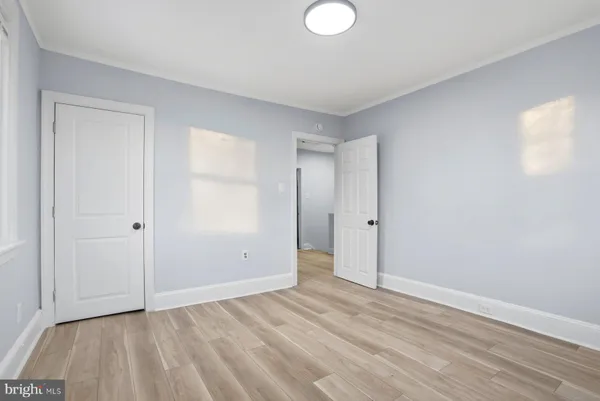 a view of an empty room and wooden floor